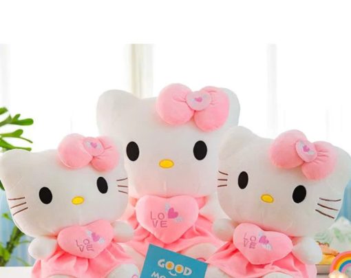 Gấu bông Hello Kitty ôm trái tim mặc váy hồng